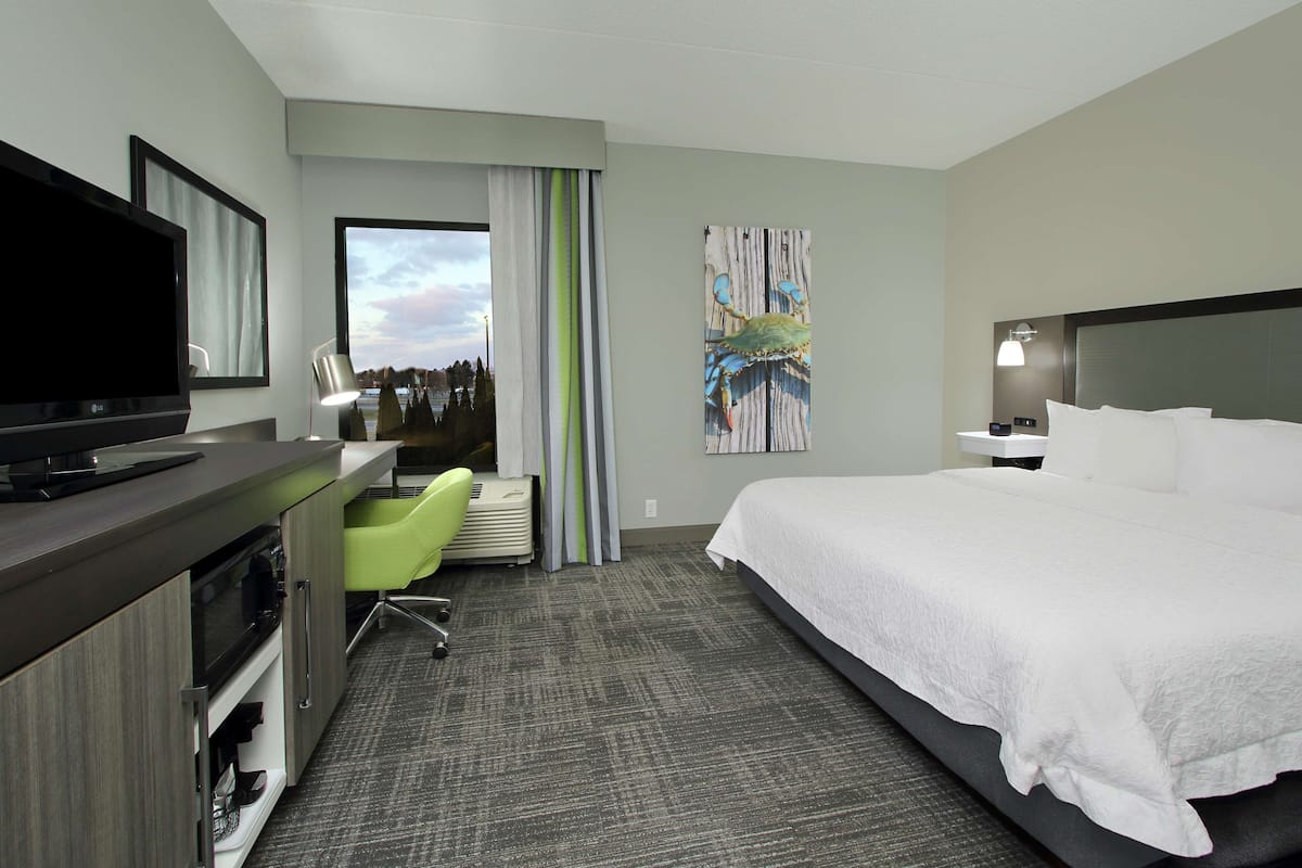 Premium bedding, desk, laptop workspace, blackout curtains