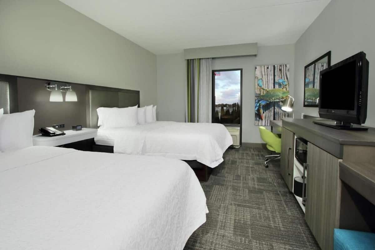 Premium bedding, desk, laptop workspace, blackout curtains