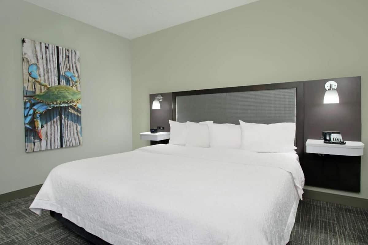 Premium bedding, desk, laptop workspace, blackout curtains