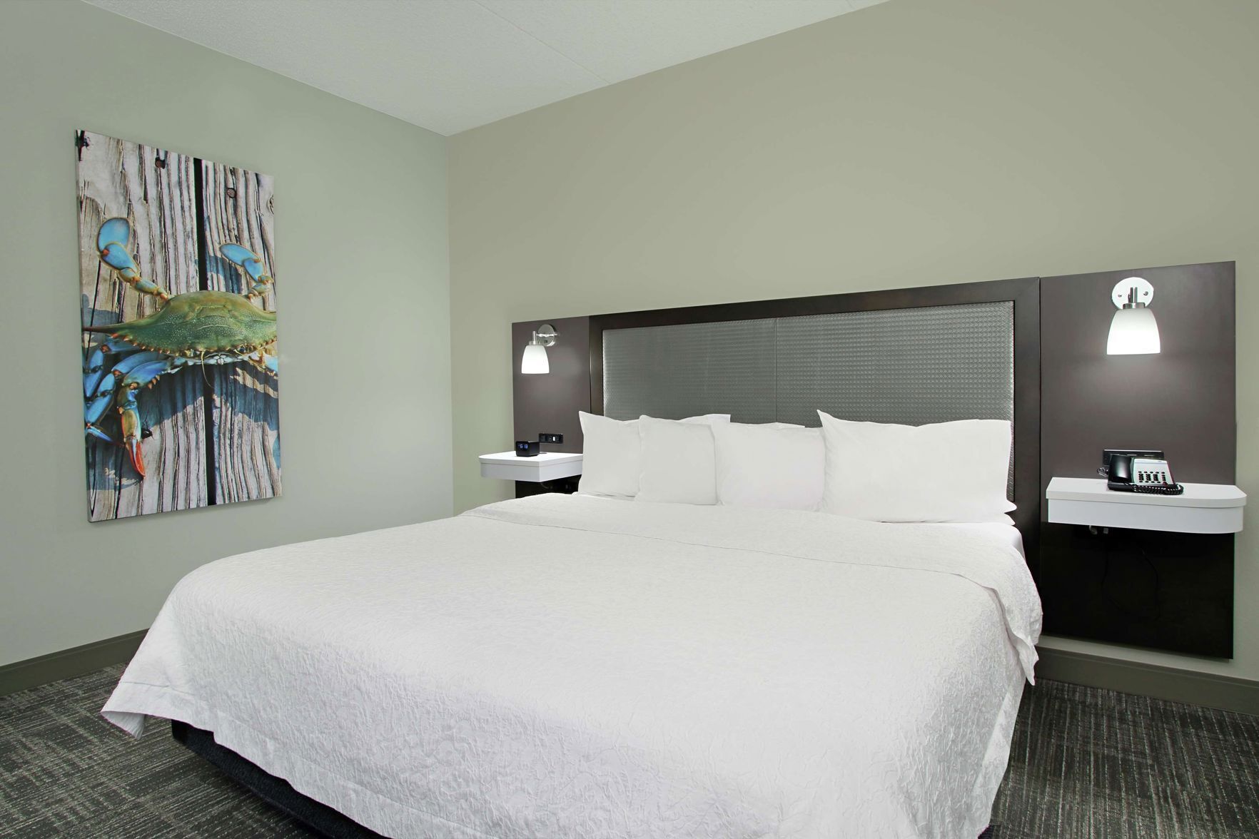 Premium bedding, desk, laptop workspace, blackout drapes