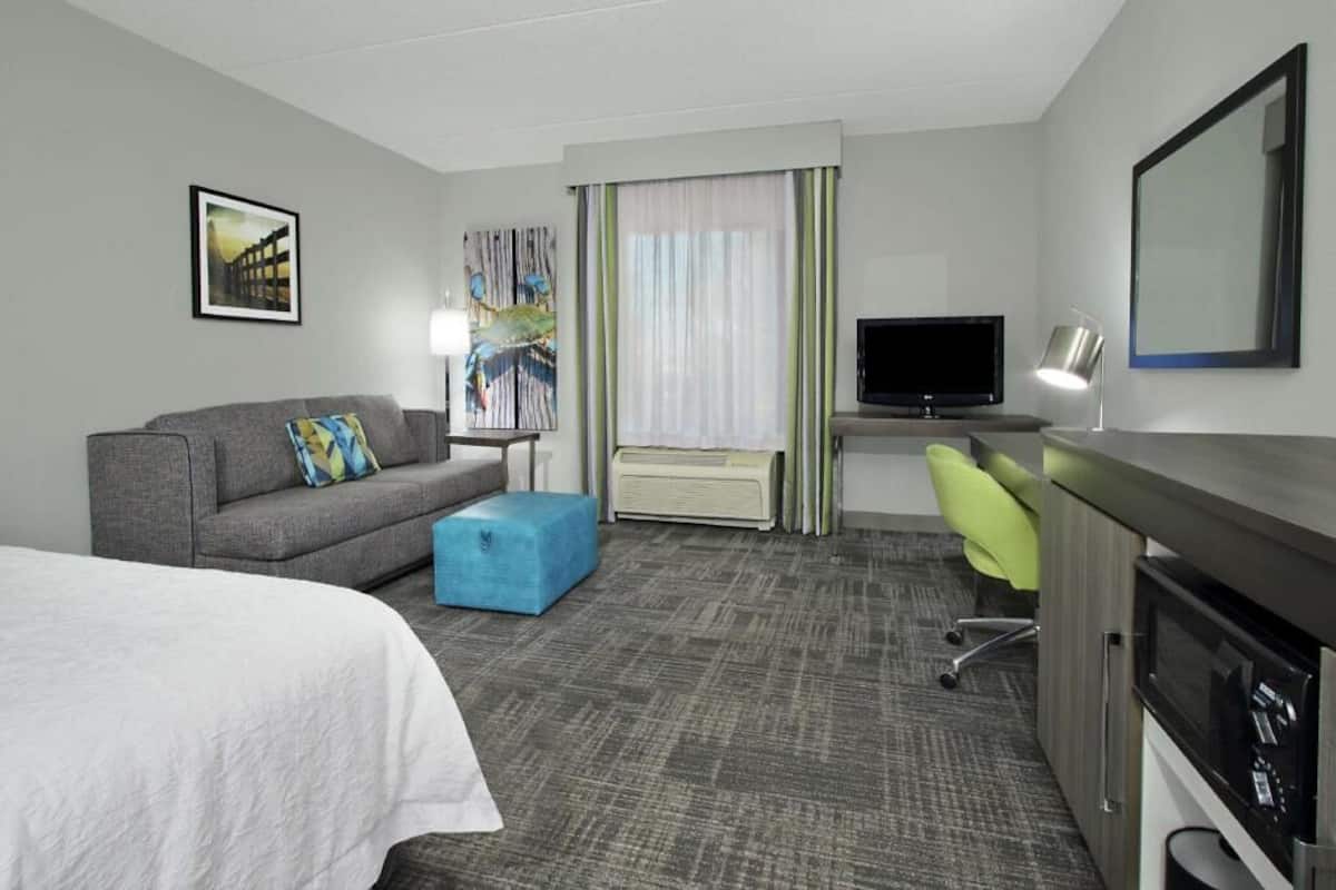 Premium bedding, desk, laptop workspace, blackout curtains