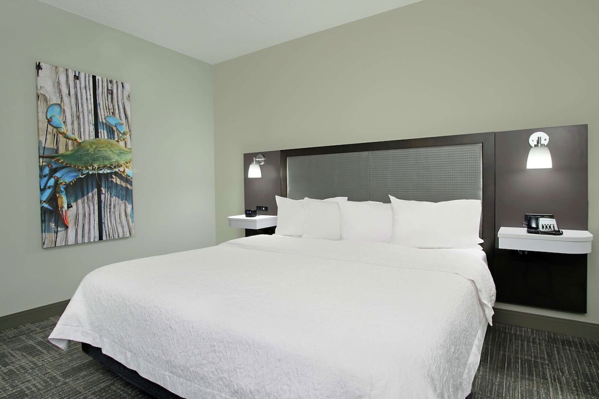 Premium bedding, desk, laptop workspace, blackout curtains