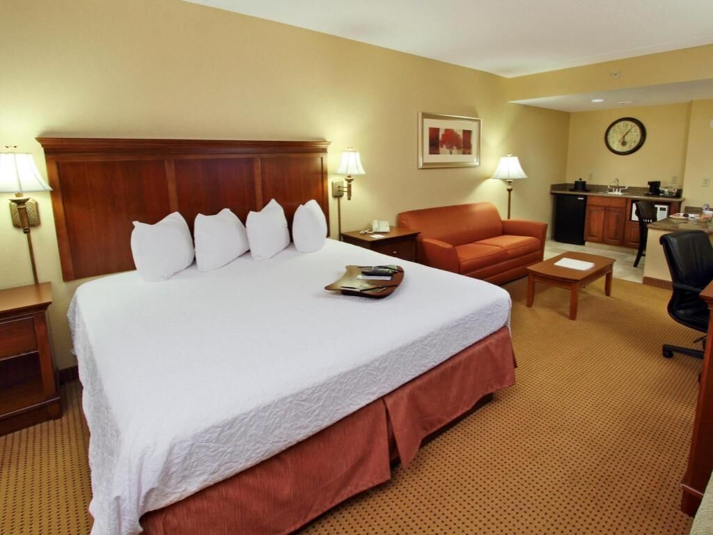 Premium bedding, desk, laptop workspace, blackout drapes