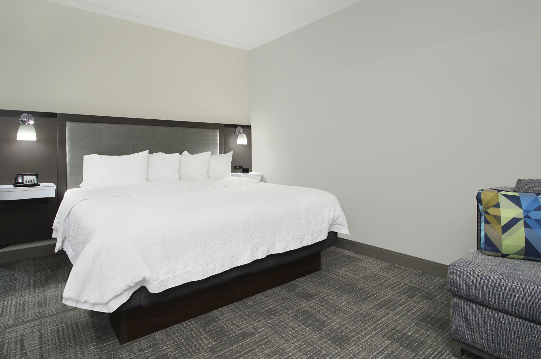 Premium bedding, desk, laptop workspace, blackout drapes
