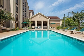 Seasonal outdoor pool, open 8:00 AM to 10:00 PM, pool umbrellas