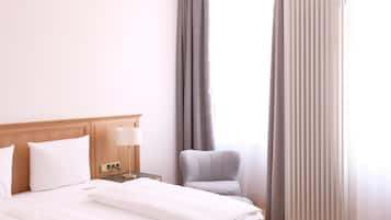 Habitación doble Confort | Ropa de cama hipoalergénica y caja de seguridad en la habitación