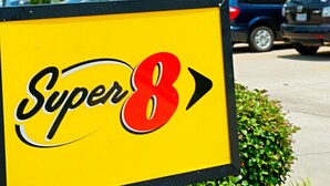 A hotel sign with "Super 8" and an arrow pointing right. - Super 8 by Wyndham Irving/DFW Apt/North (Irving)