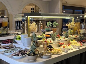 A buffet with various food items and a coffee station. - AHC Old City Hotel (Istanbul)