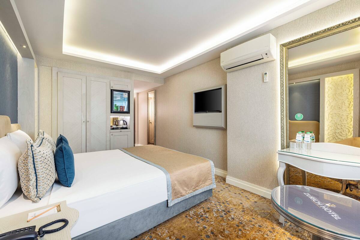 Habitación estándar con 1 cama matrimonial o 2 individuales | Minibar, caja de seguridad en la habitación y insonorización