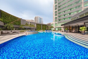 Outdoor pool, open 6:00 AM to 10:00 PM, sun loungers, lifeguards on site