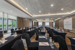 A conference room with long tables, chairs, and a projector screen displaying the logo "ASCOTT MAKATI". - Ascott Makati (Makati)