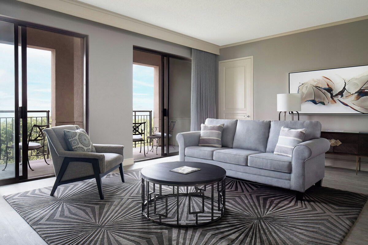 Executive Suite, 1 Bedroom, Balcony | Living room | 55-inch Smart TV with cable channels, TV, streaming services