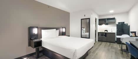 Roba de llit d'alta qualitat i espai de treball apte per a portàtils