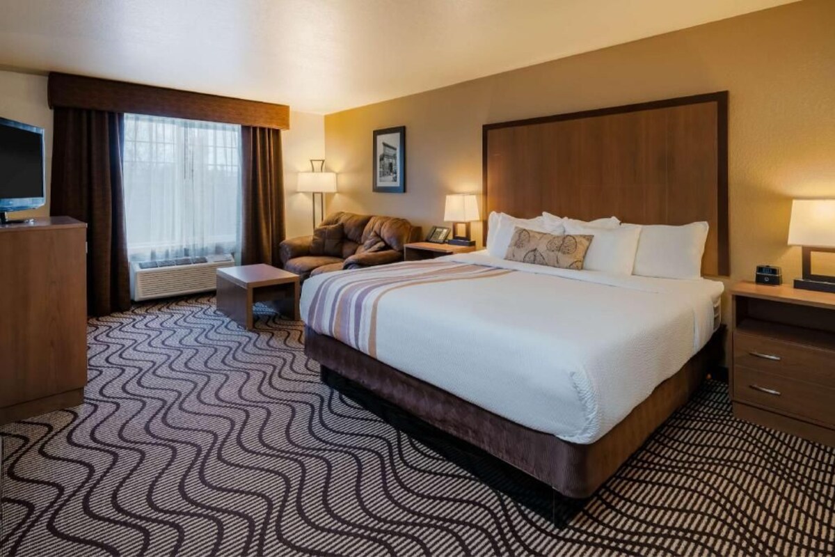 Premium bedding, pillow-top beds, laptop workspace, blackout curtains