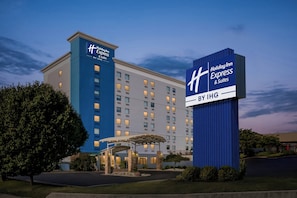 A Holiday Inn Express hotel with a prominent blue and white sign, a covered entrance, and a well-maintained lawn. - Holiday Inn Express & Suites Baltimore West - Catonsville by IHG (Catonsville)