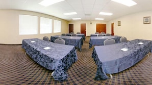 A conference room with tables covered in blue tablecloths, arranged in a U-shape. - Danbury Inn & Suites (Danbury)
