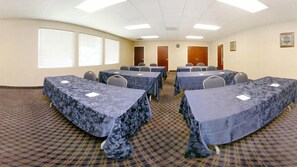 A conference room with tables covered in blue tablecloths, arranged in a U-shape. - Quality Inn & Suites Danbury near University (Danbury)