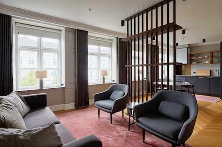 Apartment | Living area | 26-inch flat-screen TV with satellite channels, TV. Hotel SKT. Annæ