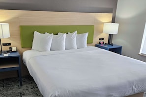 Premium bedding, desk, laptop workspace, blackout curtains