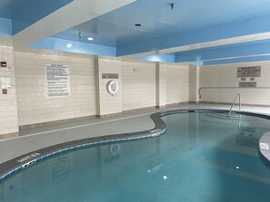 Indoor pool, open 7 AM to 11 PM, pool loungers