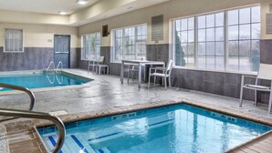 An indoor swimming pool with clear water, marked depth lines, and adjacent seating areas. - Country Inn & Suites by Radisson, Georgetown, KY (Georgetown)