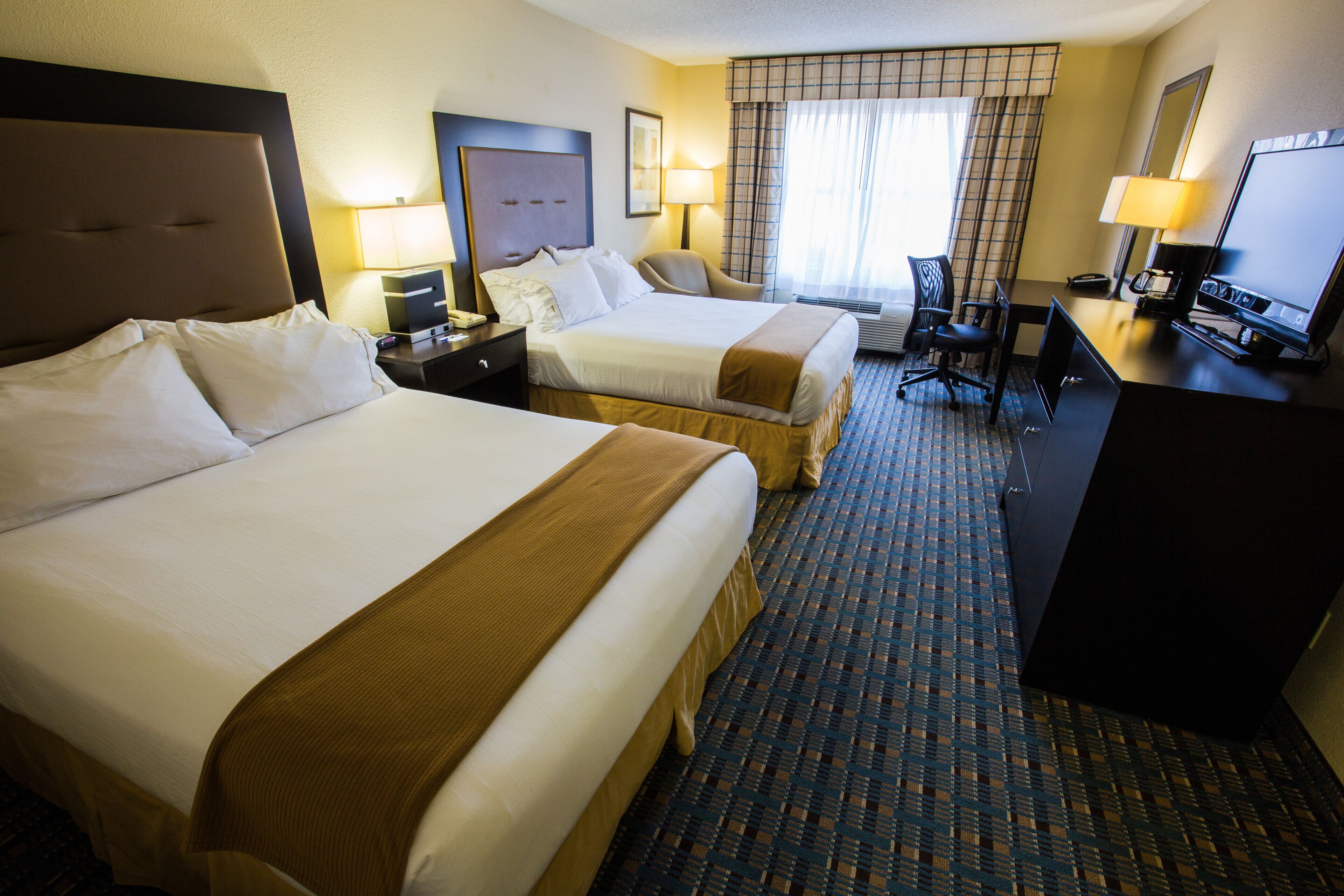 Hypo-allergenic bedding available, down comforters, in-room safe, desk