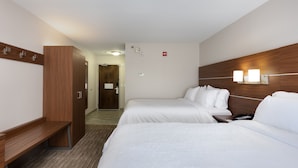 A hotel room with two beds, a wooden wardrobe, a bench, and a desk. - Holiday Inn Express Alpharetta - Roswell by IHG (Alpharetta)