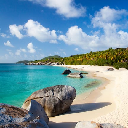 On the beach, white sand, sun loungers, beach umbrellas