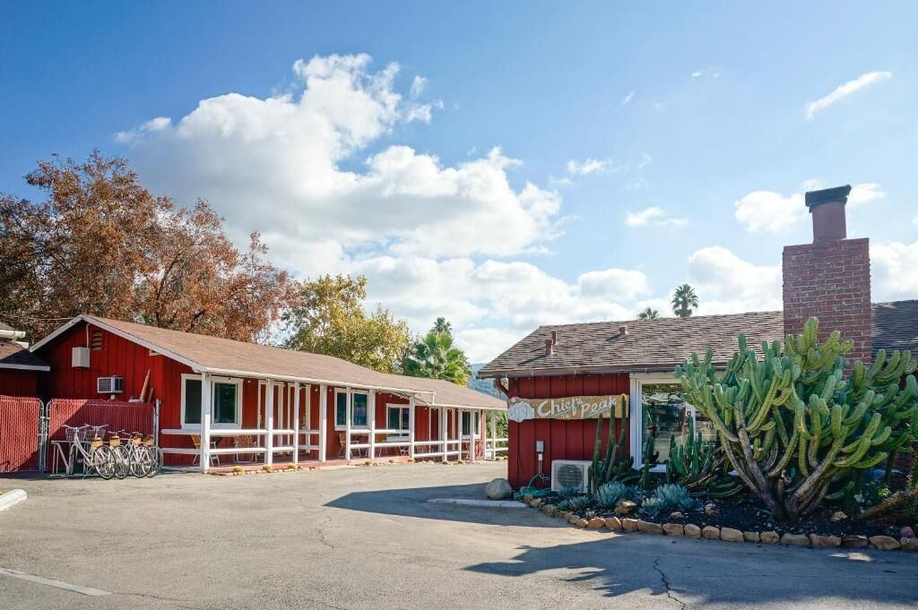 A red building with a sign reading "Chief's Peak."
