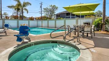 Outdoor pool, open 10:00 AM to 10:00 PM, pool umbrellas, pool loungers