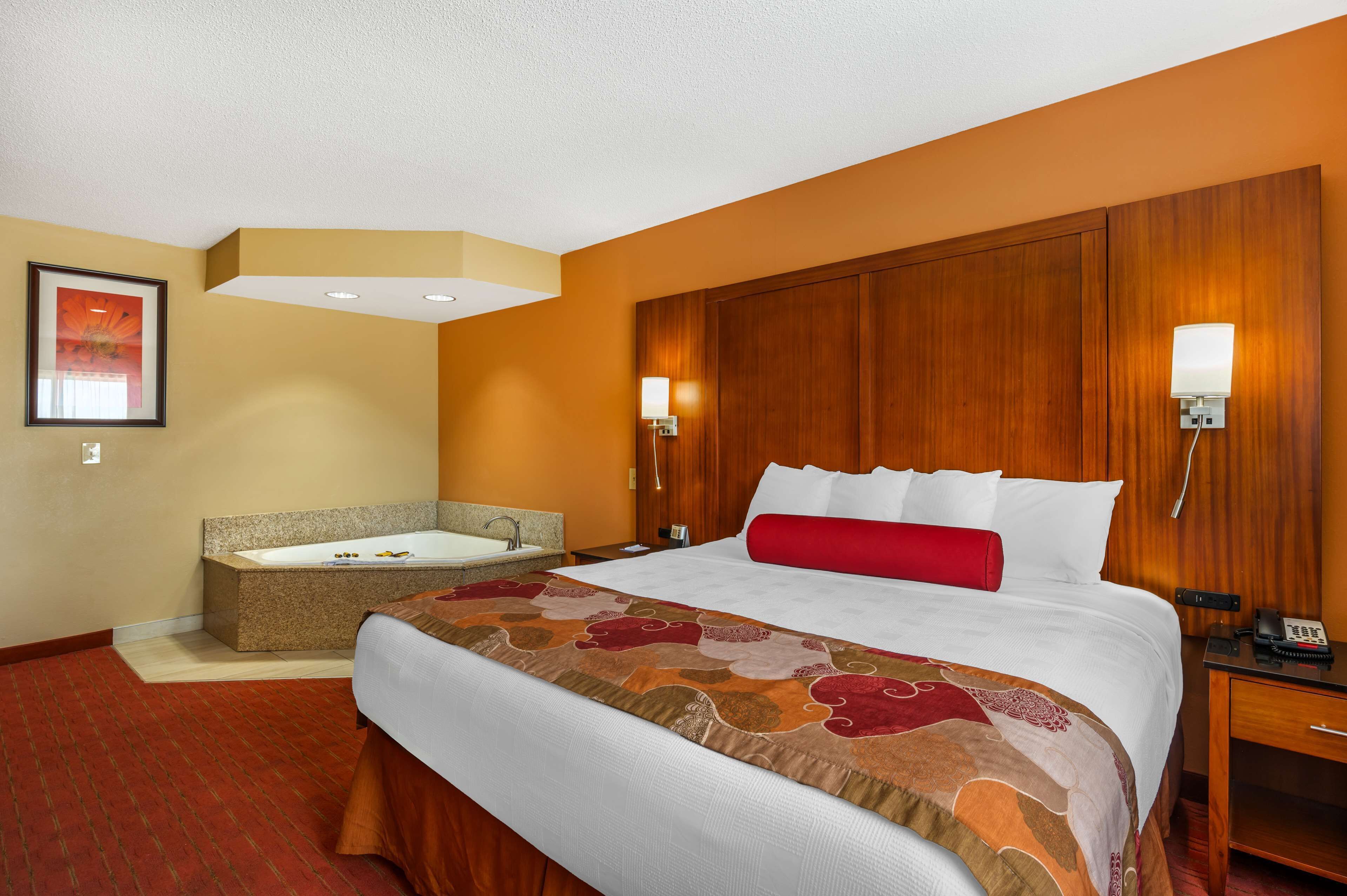 suite, 1 king bed, non smoking, jetted tub (living room;with sofabed) | desk, blackout curtains, iron/ironing board, cots/infant beds