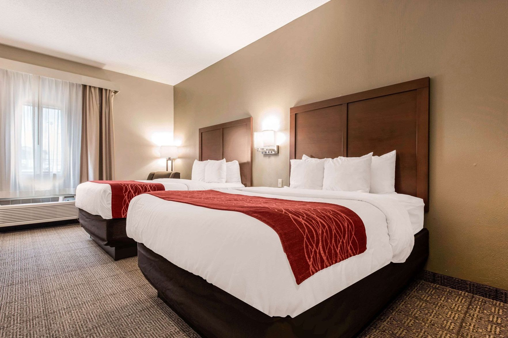Premium bedding, desk, laptop workspace, blackout drapes