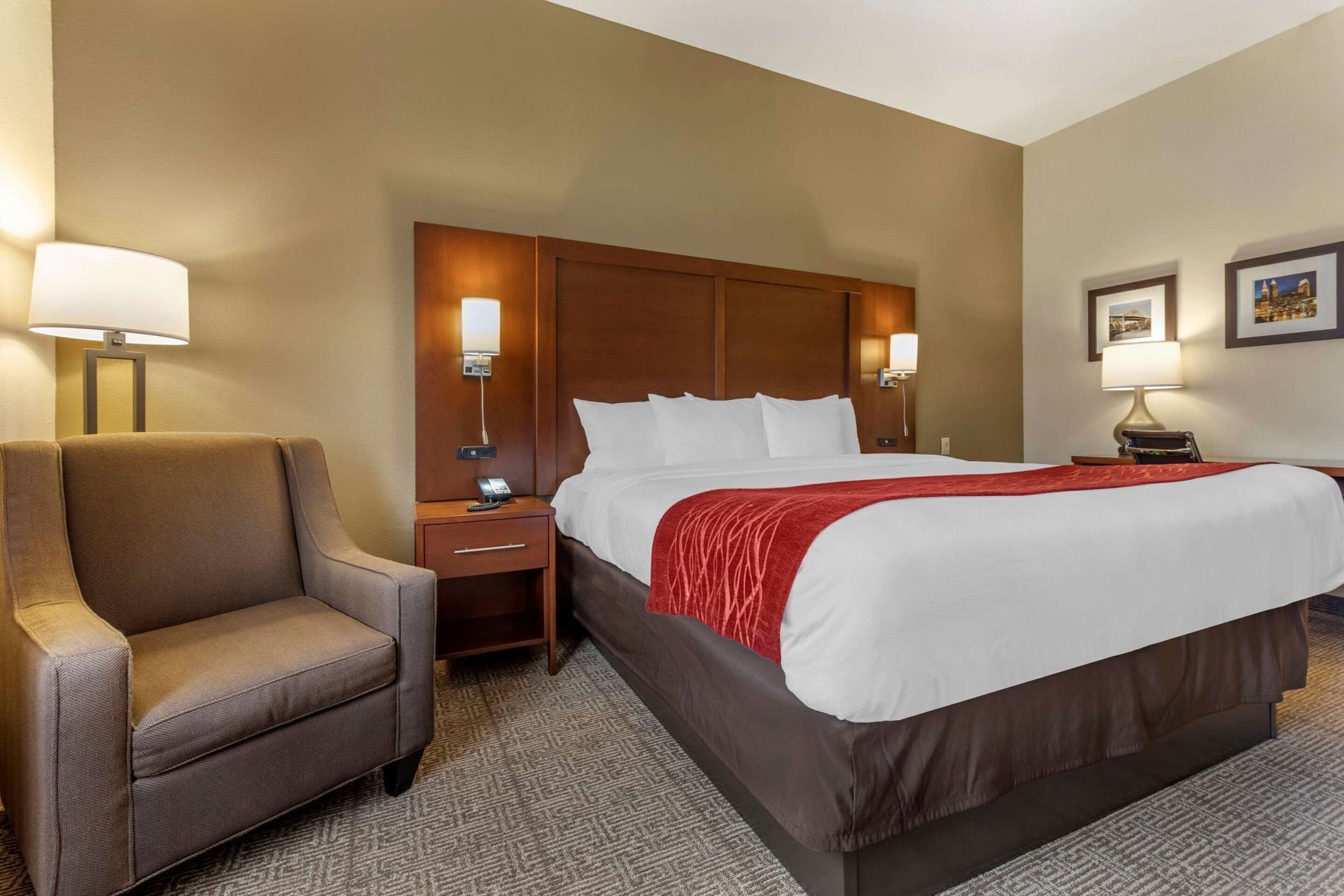Premium bedding, desk, laptop workspace, blackout drapes