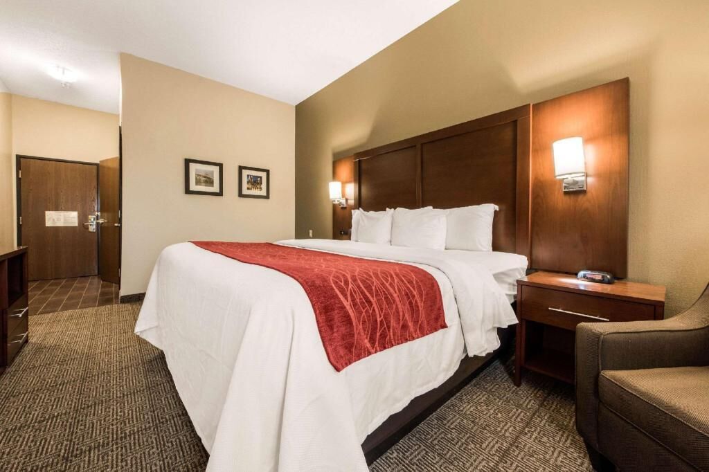 Premium bedding, desk, laptop workspace, blackout drapes
