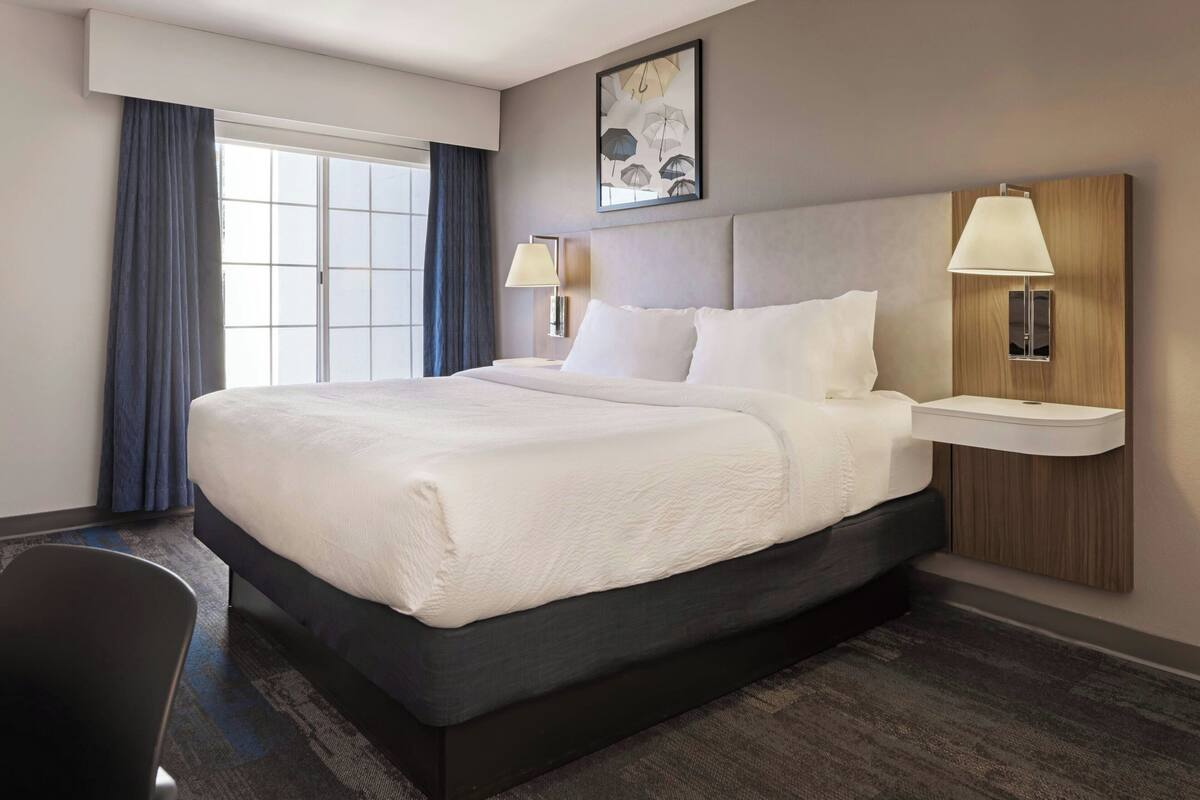 Blackout drapes, iron/ironing board, WiFi (free), alarm clocks