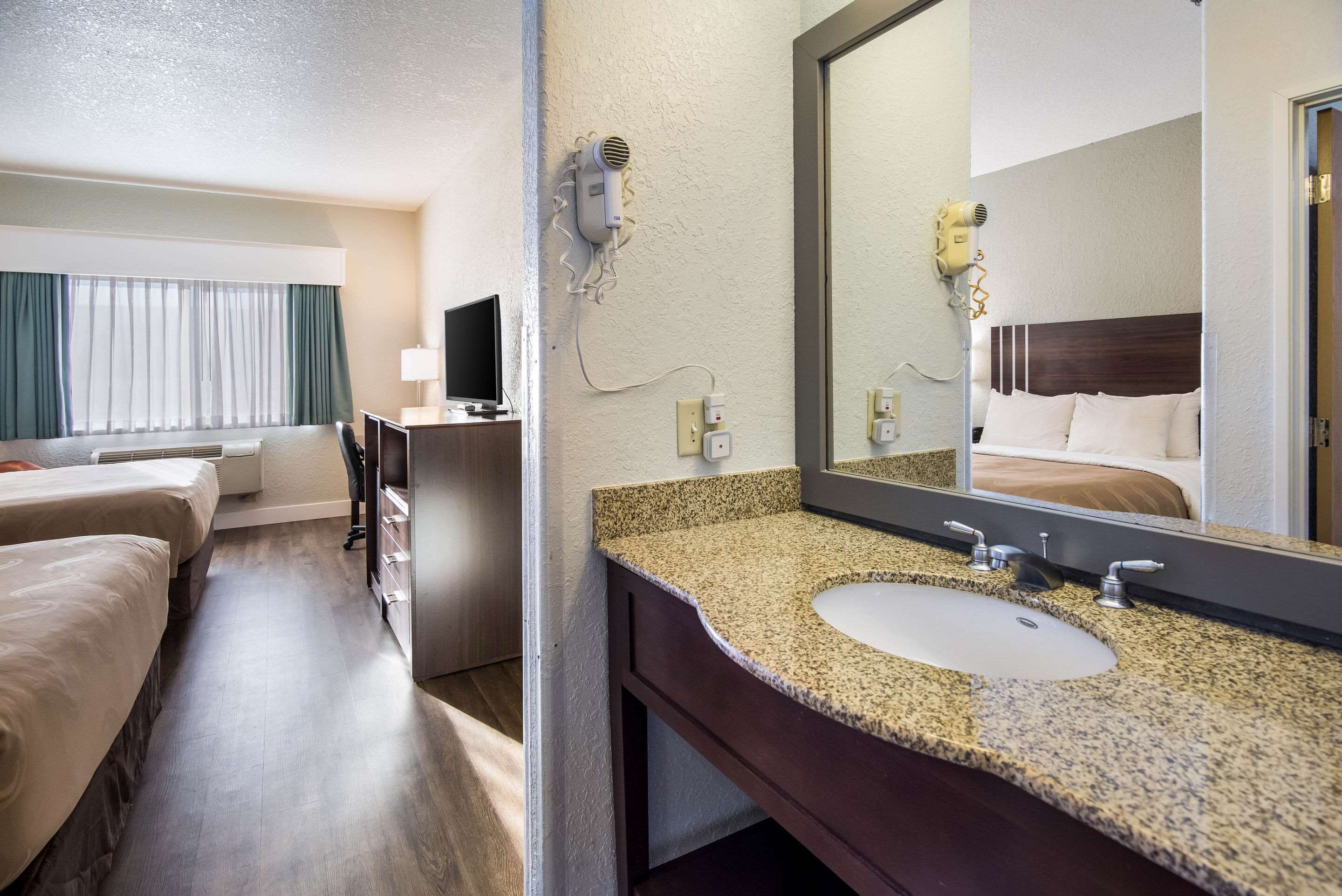 standard room, 2 queen beds, non smoking | bathroom | combined shower/bathtub, hair dryer, towels