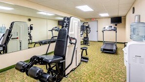 A gym with exercise equipment, a water dispenser, and a treadmill. - Quality Inn Burkeville Hwy 360 & 460 (Burkeville)