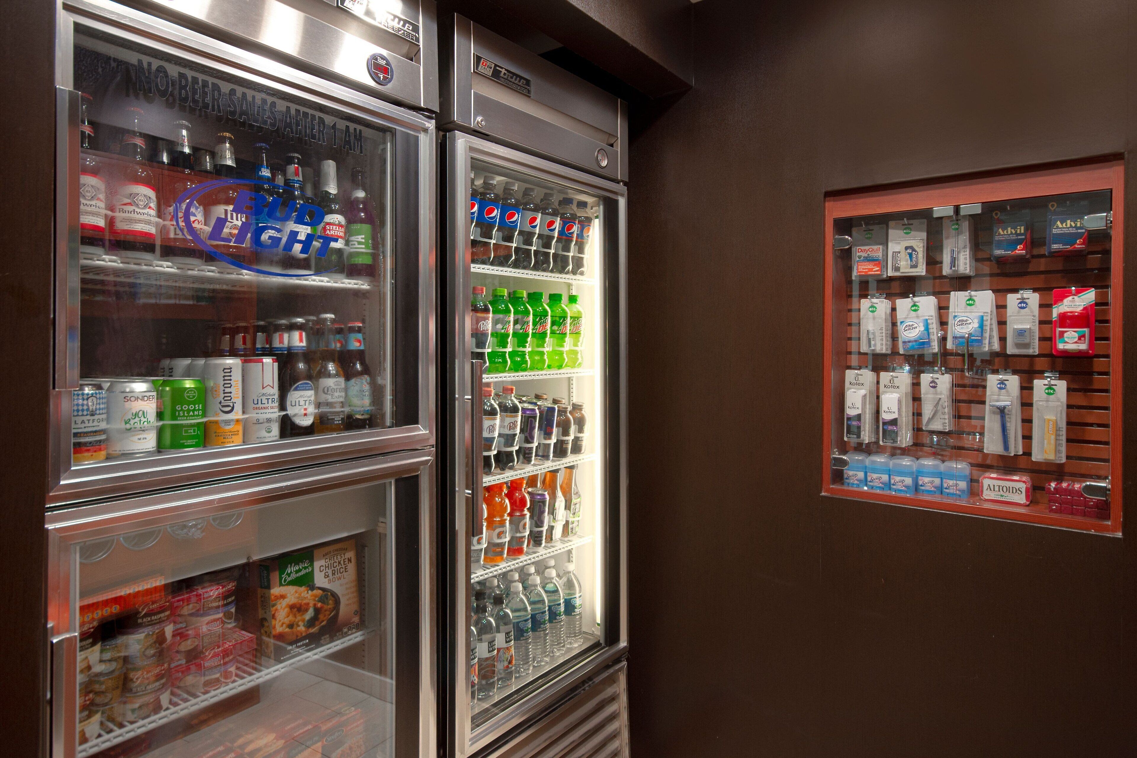 A vending machine with various beverages and snacks, including sodas and beer.