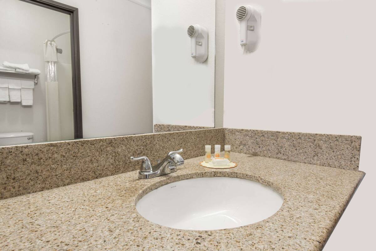 deep-soaking bathtub, free toiletries, hair dryer, towels