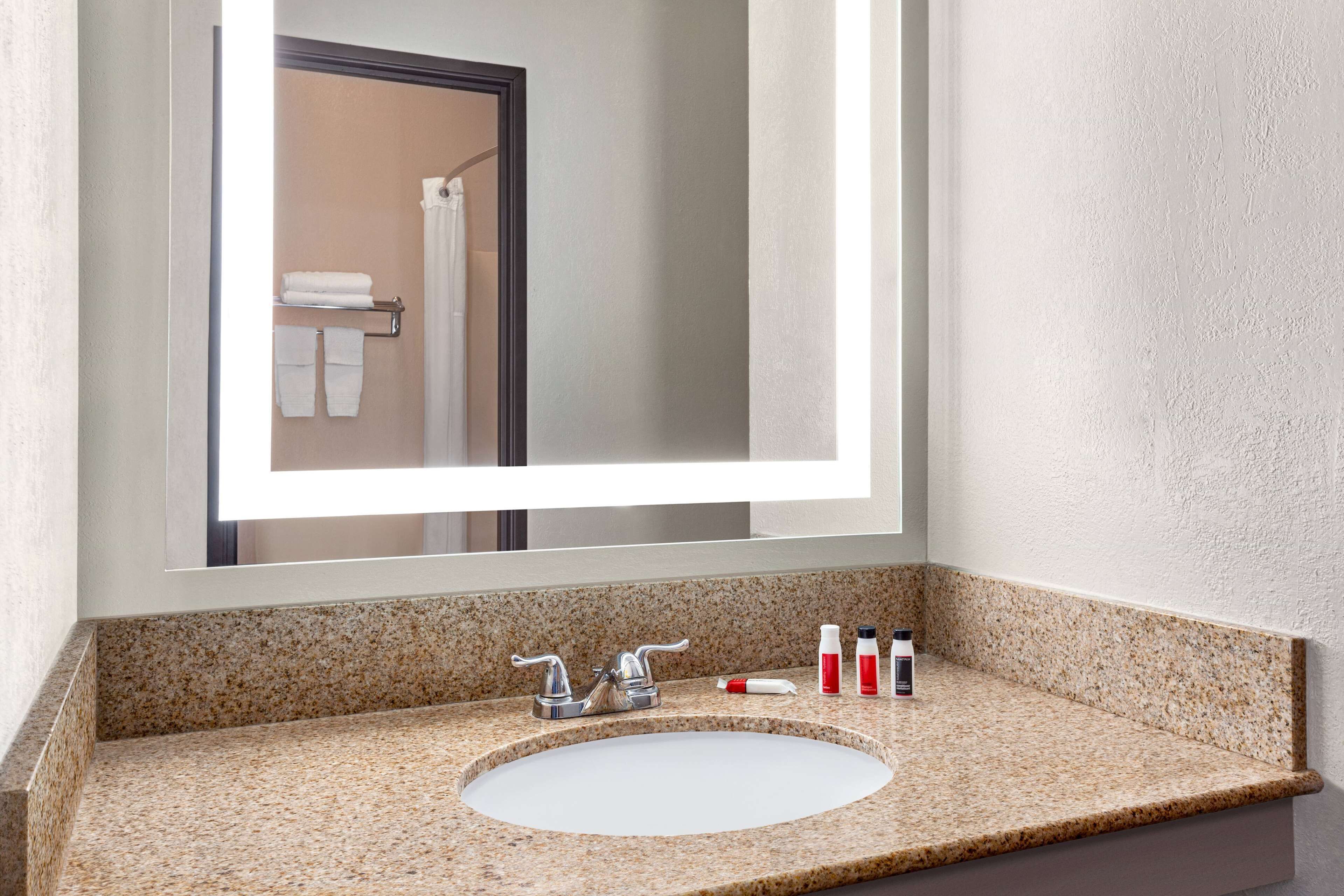 suite, 2 queen beds, non smoking | bathroom | deep-soaking bathtub, free toiletries, hair dryer, towels