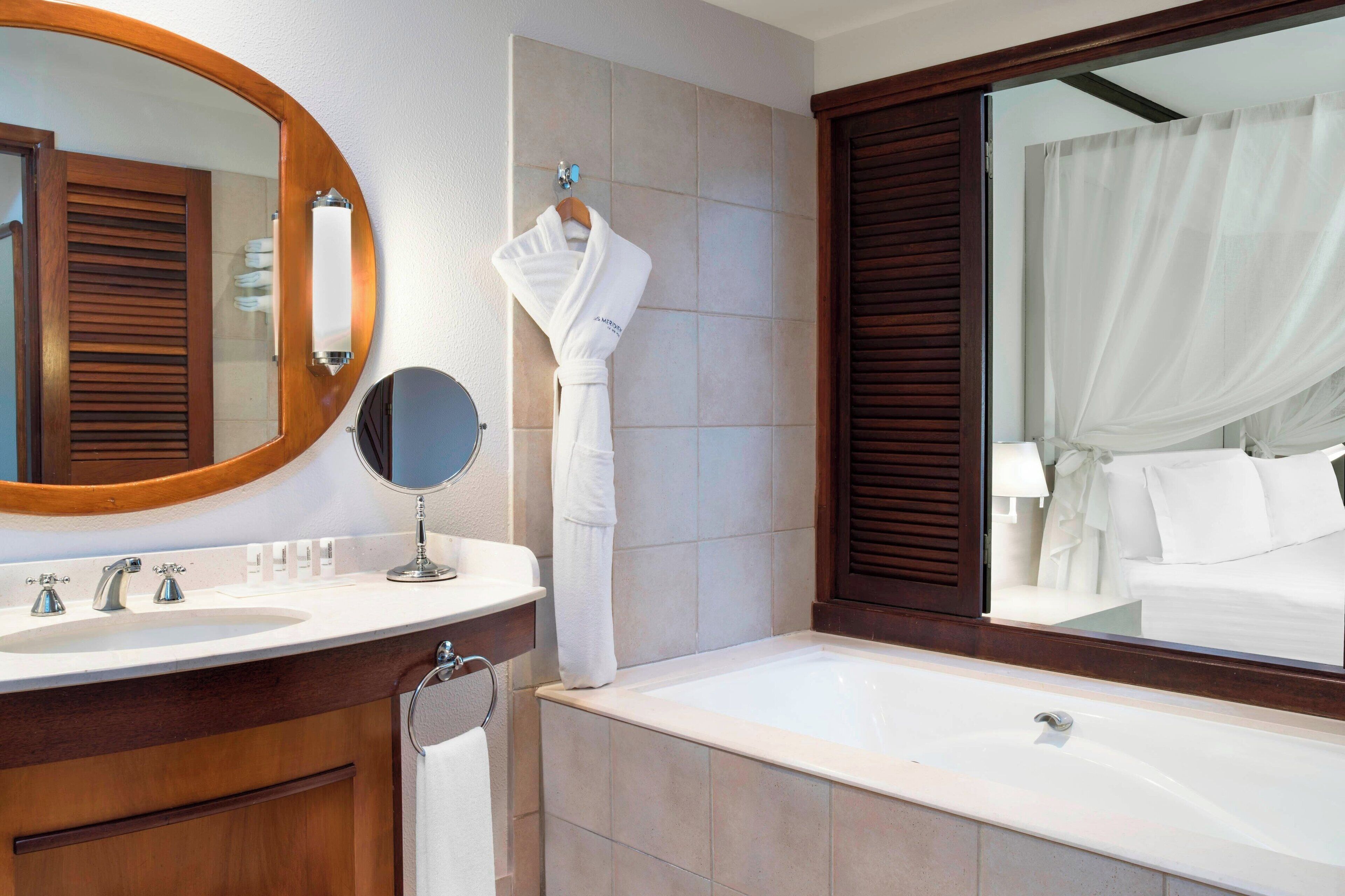 separate bathtub and shower, deep-soaking bathtub, rainfall showerhead