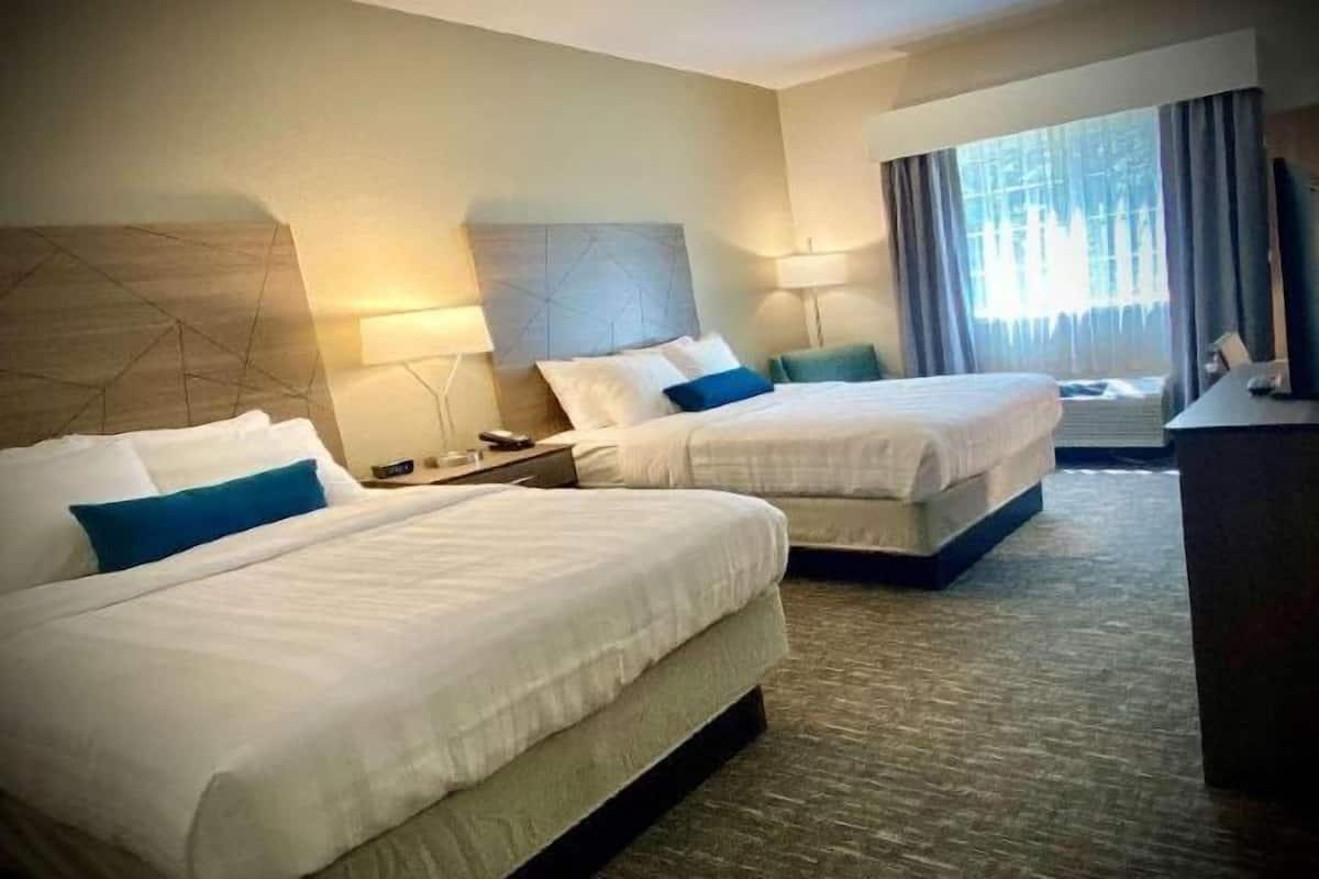 Desk, laptop workspace, blackout drapes, iron/ironing board