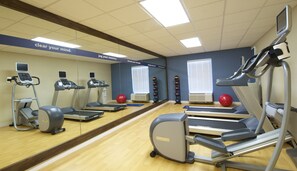 A gym with treadmills, elliptical machines, and exercise balls. - Hampton Inn Terre Haute (Terre Haute)