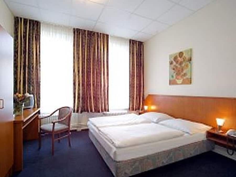 Ropa de cama de alta calidad y tabla de planchar con plancha