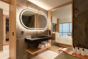 Separate tub and shower, designer toiletries, hair dryer, bathrobes