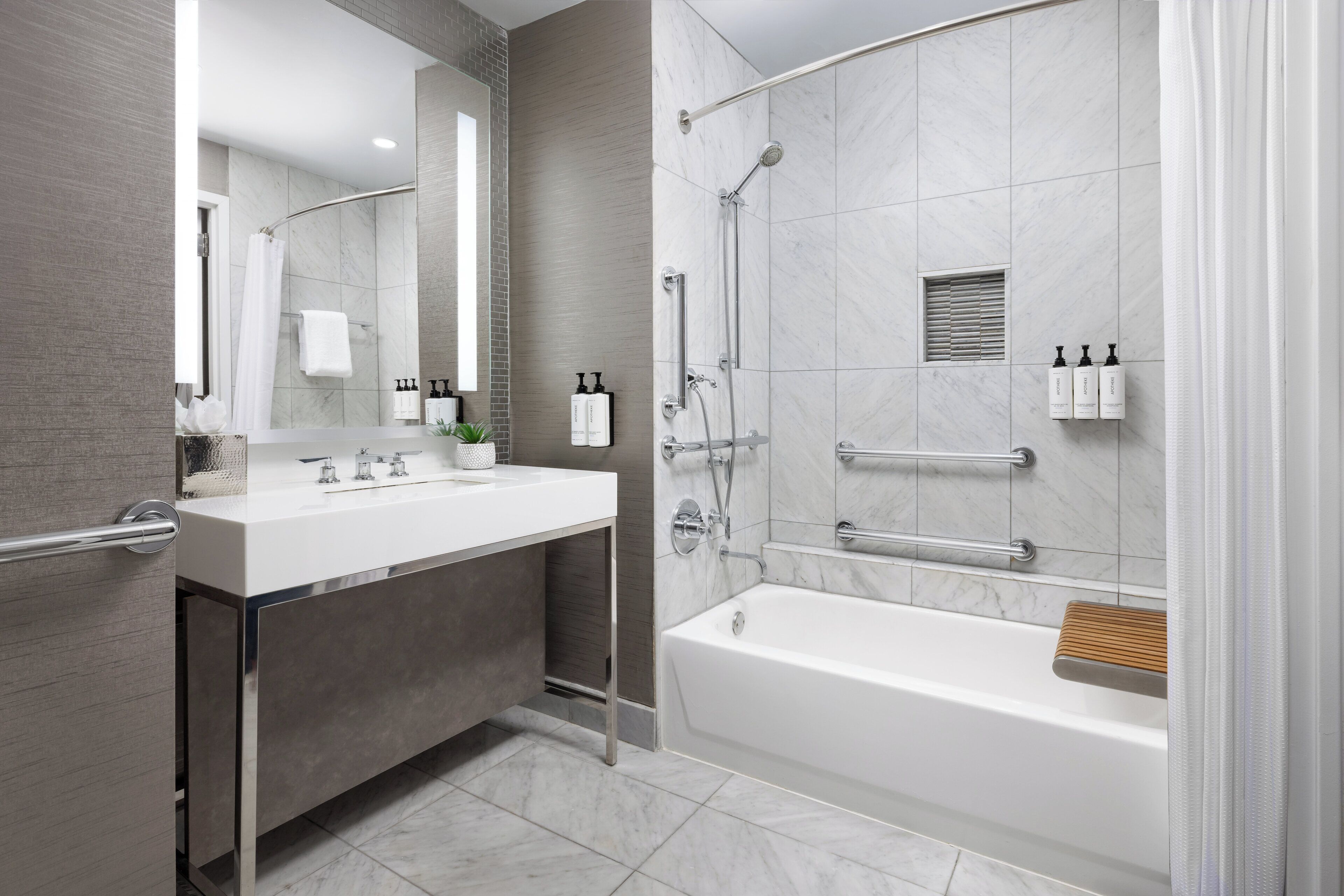 designer toiletries, hair dryer, towels, soap