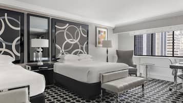 Ropa de cama de alta calidad y caja de seguridad en la habitación