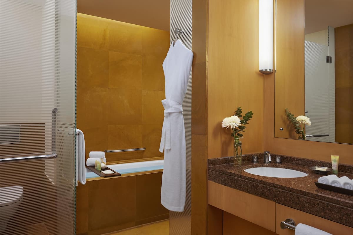 Deep-soaking bathtub, rainfall showerhead, free toiletries, hair dryer