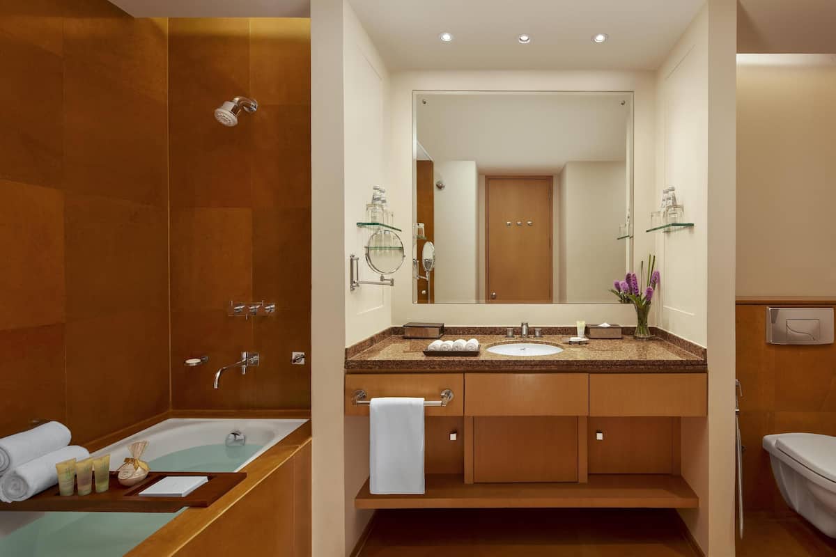 Deep-soaking bathtub, rainfall showerhead, free toiletries, hair dryer