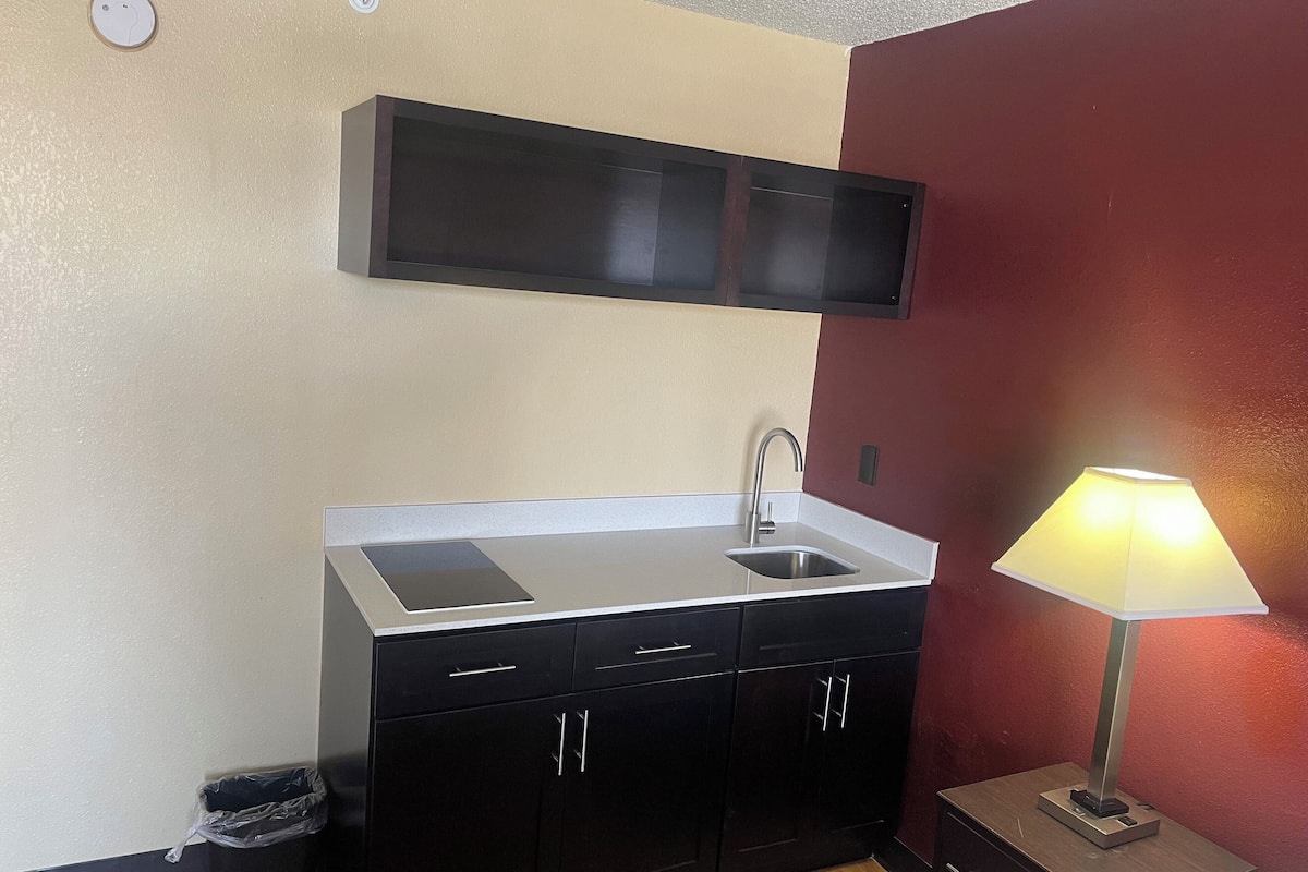 desk, laptop workspace, blackout curtains, rollaway beds